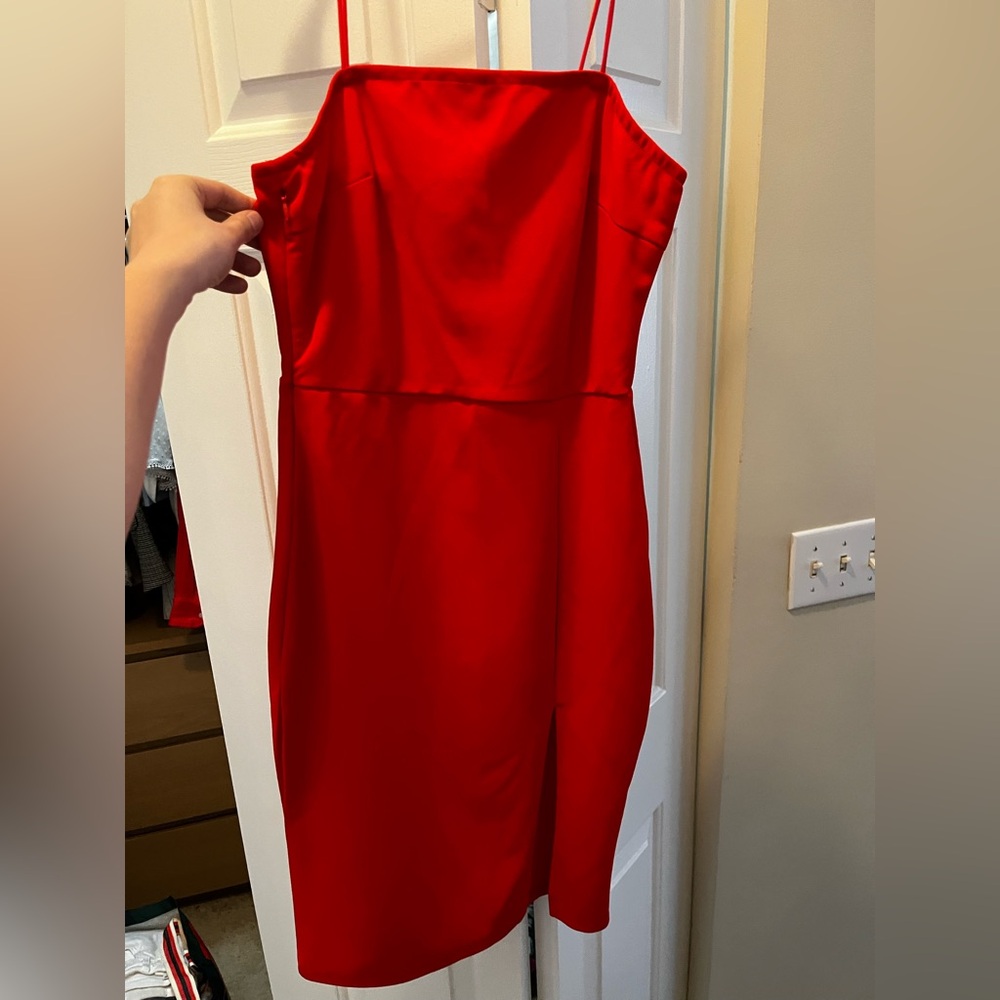 Red/orange mini dress with thin straps and small slit. Never worn